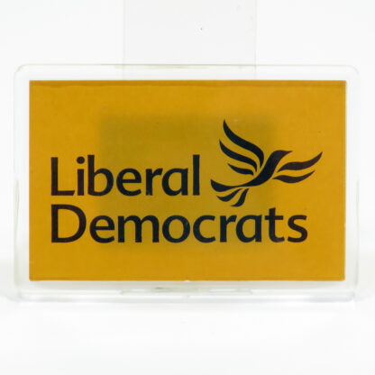 Clear plastic fridge magnet with gold background and Lib Dem logo