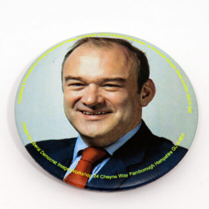Round badge with picture of Ed Davey