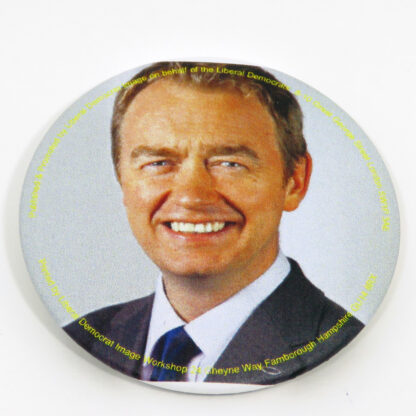 Round badge with picture of Tim Farron
