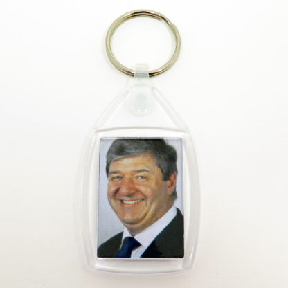 Keyring and clear plastic fob with picture of Alistair Carmichael